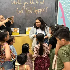 The children are completely captivated during our "Gol Gappa" story session. We encourage them to gather close, ask questions, and be a part of the narrative.