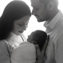 Another angle of this beautiful family, focusing on their loving expressions. The black and white format makes the emotional connection the central focus.