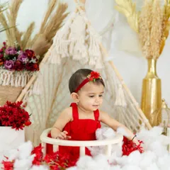 A candid moment from the same session, with a simple and natural bohemian background.