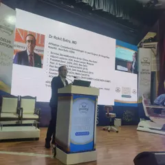 On stage delivering a talk on the latest technologies and safety protocols for laser hair removal. My goal is to educate budding dermatologists on how to achieve the best outcomes for their patients.