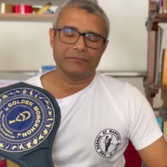 Our founder and head coach, Ashwin Naidu, proudly holding the Golden Mongkhon National Champion title belt. His personal achievements in the ring are a direct inspiration for every student at our school.