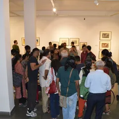 A crowd of visitors listening intently as Gulammohammed Sheikh speaks about his work. These moments of direct interaction between the artist and the public are incredibly valuable.