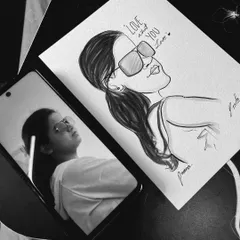 "Love what you love." This shows the original photo on the phone next to the finished stylish caricature, a perfect example of my process.