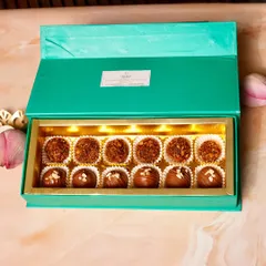Our elegant green truffle box, filled with an assortment of handcrafted chocolates. A sophisticated gift for Rakhi or any special day.