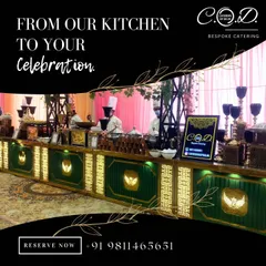 A look at our grand buffet setup for an evening event. The dark green and gold counter is backlit for a dramatic effect, with our chefs ready to serve guests, showcasing our commitment to both style and service.