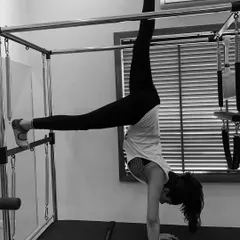 This handstand variation uses the Cadillac for support, allowing you to build the strength and confidence needed for inversions. It's a fantastic way to challenge your body and improve proprioception.