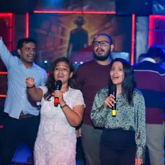 This is what it's all about. A group of friends sharing a mic, singing their favorite song together. My karaoke nights are designed to bring people together and create these moments of pure joy and connection.