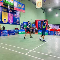 Our coach in action during a competitive doubles match at the Agra Badminton Premier League. This on-court experience is directly translated into the training our players receive.
