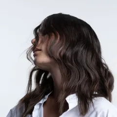 Creating beautiful, textured summer waves. This look was achieved by layering three key products: Texture Maker, Shaper Zero Gravity, and Trilliant for shine and heat protection.