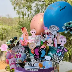 This "Parents to be" hamper is a celebration in a box, perfect for a baby shower or gender reveal. It’s personalized with the couple's photos and filled with snacks and cute baby-themed cutouts.