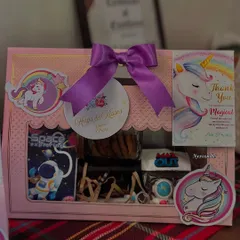 This is our popular Unicorn and Space themed hamper, a perfect return gift for kids' birthdays. It includes a mix of items like cookies, stationery, and a personalized thank you card, all beautifully packaged.