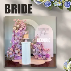 This pastel floral 'Bride to be' setup offers a softer, more romantic aesthetic. The design uses two arched backdrops and an explosion of pink and lavender flowers, with a dedicated pedestal for the cake.