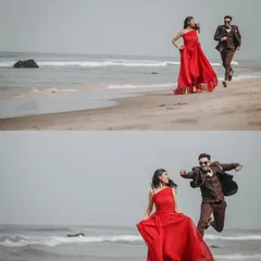 Capturing pure joy and energy as the couple runs and leaps along the shoreline.