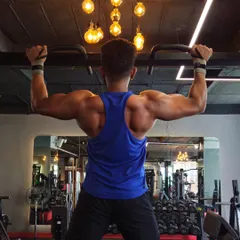 Building a wide back with pull-ups. This is a foundational bodyweight exercise that I include in many programs to develop the lats and overall upper body pulling strength.