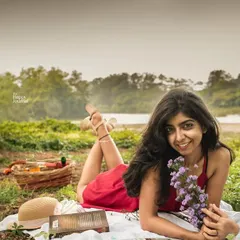 This personal branding portrait was shot outdoors to create a relaxed and natural vibe. It's perfect for an influencer or creative professional who wants to show their personality. The picnic setup and natural landscape add a layer of storytelling to the image.