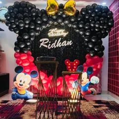 An identical shot of the Mickey Mouse setup, highlighting the neon "Happy Birthday" sign.