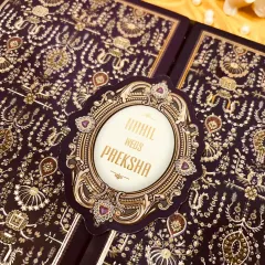 This design is pure opulence. I chose a deep aubergine velvet finish and paired it with intricate gold foil work inspired by royal tapestries. It's an invitation that feels as rich and special as the bond it represents.