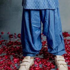 A close-up of our blue Patiala pants. The soft, breathable fabric and comfortable design make them perfect for active boys who love to run and play.