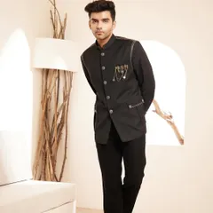 The full look of our black Jodhpuri suit, showcasing its impeccable fit and the way it commands attention with its modern, edgy details.