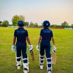 Two of our hard-hitters, ready to take on the world. The back of the jersey says "Future Champions" and we believe it.