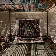 An immersive installation from Archana Hande's 'WEAVING LIGHT'. I believe in transforming spaces. Here, we used light and shadow projected through traditional jacquard loom punch cards to create a magical, shifting landscape that tells a story of craft and technology.