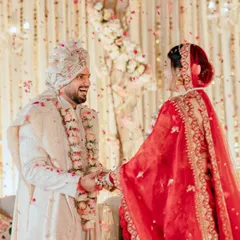 The laughter and love shared between the bride and groom during their Varmala ceremony. These are the candid, joyful moments that make a wedding story truly personal.
