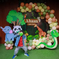 The birthday boy strikes a pose, ready for his wild adventure. Our jungle theme is perfect for energetic kids who love to explore.