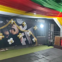A closer look at the wall decor for the gym event. I used simple gold and white balloon flowers with tulle fabric to decorate the walls, matching the festive theme while keeping the space open.