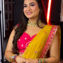 This vibrant multi-color lehenga in shades of yellow, pink, and green is perfect for a Mehendi or Haldi function.