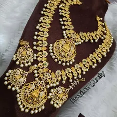 A premium quality temple jewellery set available for rent. This one features beautiful Goddess Lakshmi motifs, surrounded by pearls, perfect for a traditional bride.