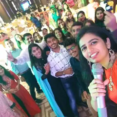 The audience members are my real cheerleaders. This selfie captures the incredible energy and love I get back from the crowd. Connecting with people and seeing their happy faces is the most rewarding part of being an event host.