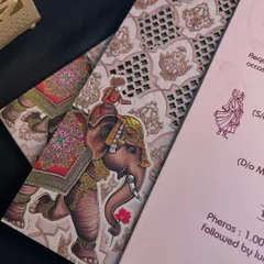 The majestic elephant illustration appears to walk right off the laser-cut panel, creating a dynamic and layered composition.