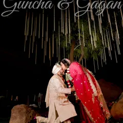 A dramatic and romantic proposal pose under a beautifully decorated tree at night. This shot is all about creating a magical, unforgettable moment.