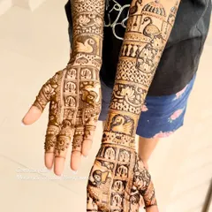 A stunning engagement mehendi with full coverage. This design is filled with traditional elements like swans, peacocks, elephants, and architectural domes.