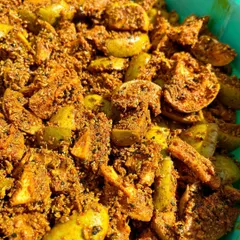Let's take a moment to appreciate this beauty. This is our bestseller, Punjabi Aam ka Achaar, in the making. The raw mangoes are mixed with spices and left to soak in all the flavours.