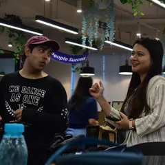A moment of interaction during a corporate wellness session. It's about connecting through dance.