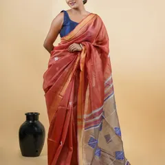 This lightweight linen-blend saree is perfect for daytime events. It's a ready-to-wear piece that combines the breezy comfort of linen with the convenience of a pre-stitched design.