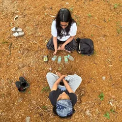 I become such a child in Mother Nature's lap. This playful attitude, captured in this overhead shot of a reading in the woods, allows me to approach my work with an open heart, infusing it with authenticity.