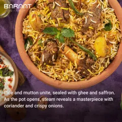 The grand finale of my Calcutta Mutton Biryani, where rice and mutton unite, sealed with ghee and saffron, and garnished with coriander and crispy onions.