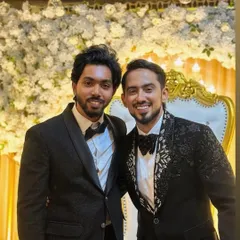 Suited up and looking sharp. These gentlemen are ready for a wedding celebration in our stylish black suits and tuxedos.