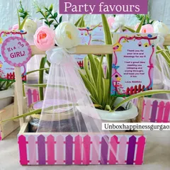 These party favors combine a lasting gift of a plant with a sweet treat. The pink picket-fence design makes it a charming choice for a baby girl's announcement or first birthday.