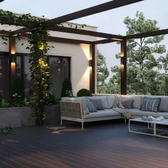 We design serene rooftop terraces that become your private escape, complete with a comfortable sectional sofa, lush greenery, and ambient lighting for perfect evenings.