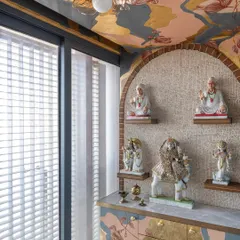 A mandir is more than a space; it's a sanctuary. For this home, I designed and painted a 'Fortune Shrine', creating a serene and sacred environment. The abstract patterns and hints of gold are meant to evoke a sense of peace and devotion, making the space truly divine.