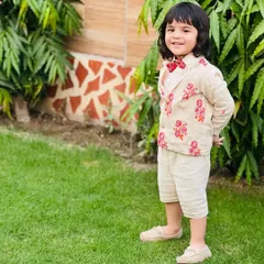 A full-length shot of the custom embroidered suit for boys. This outfit is perfect for weddings and formal family events, combining style with comfort for active kids.