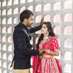 Blushing in Pink, Dashing in Blue. This couple is a match made in rental heaven with our pink lehenga and navy Jodhpuri suit.