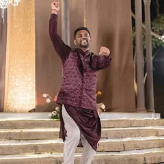 The groom rocks the stage with his solo act. It's not just the brides who get to be in the spotlight.