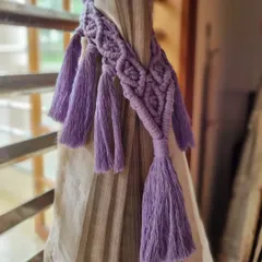 Our macrame curtain tie-back in a lovely lavender shade. It's a simple way to introduce texture and color into your home decor.