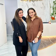 Dr. Ritu with a happy client at our reception. Building a trusting relationship with each person who walks through our doors is fundamental to our practice.