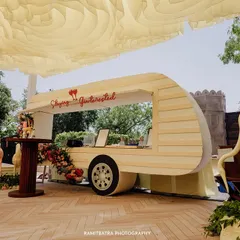 A shot of the quirky and stylish decor at a Jaipur wedding, featuring a custom guestbook caravan.