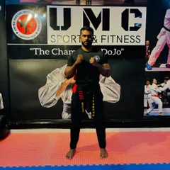 Celebrating progress and dedication. A student is recognized during our Kickboxing Belt Grading Exam, a formal event where members demonstrate their skills to advance in rank.